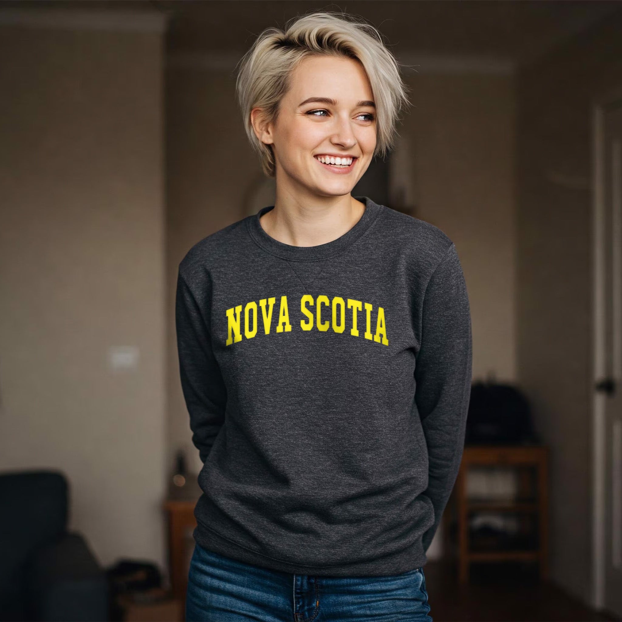 A grey crewneck with 'NOVA SCOTIA' printed in yellow on front