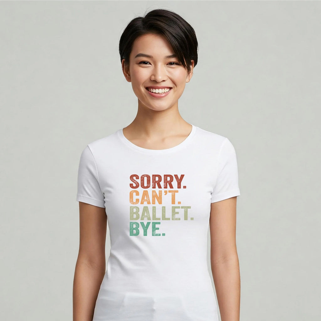 Person wearing a white t-shirt with colorful text on a plain background