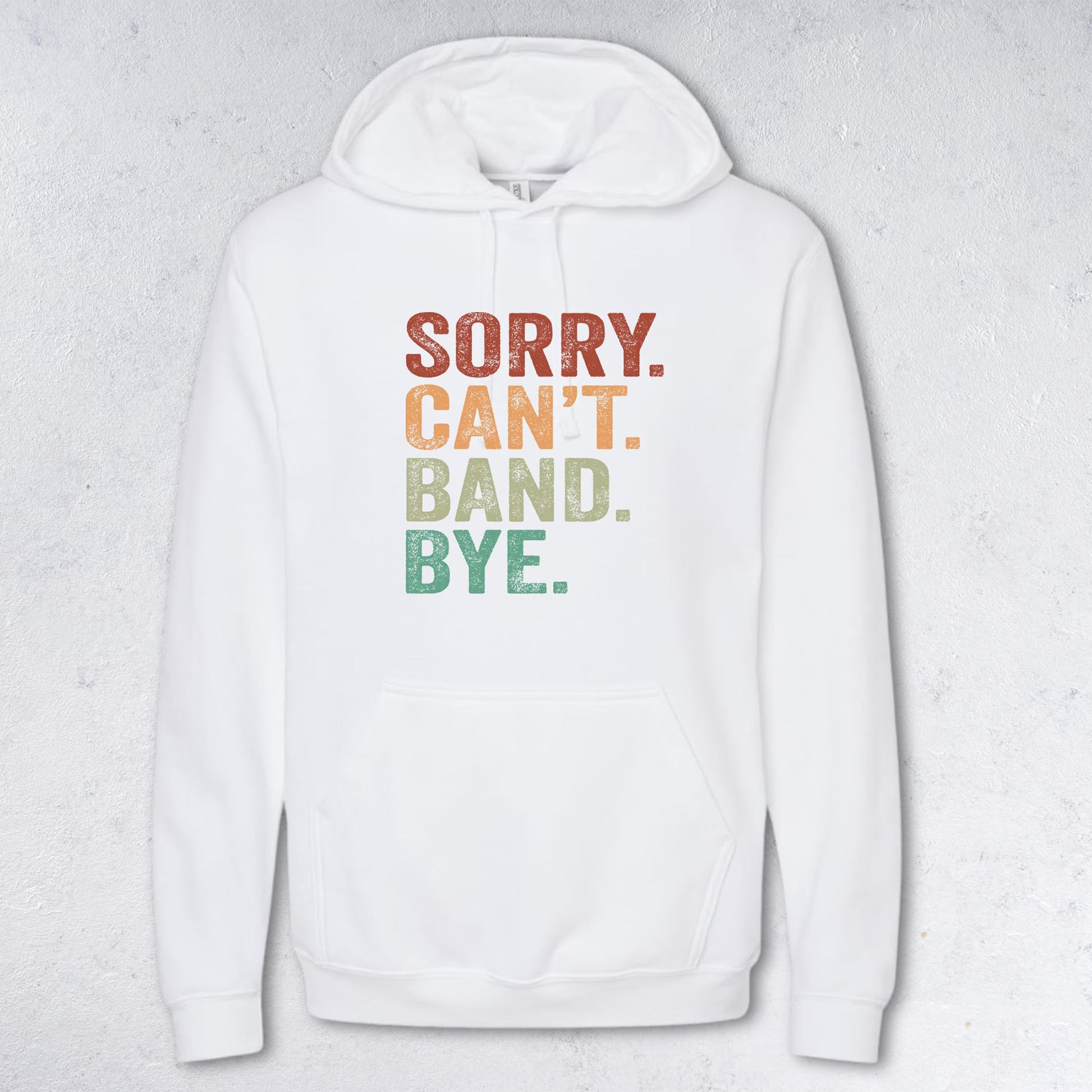 White hoodie with colorful text 'SORRY. CAN'T. BAND. BYE.' on a light gray background