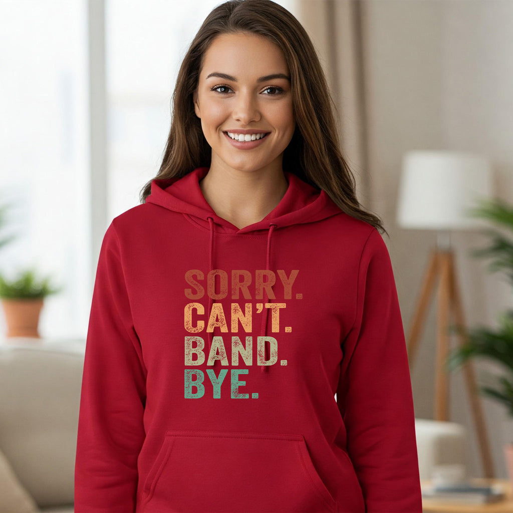 Woman wearing a red hoodie with text in a living room