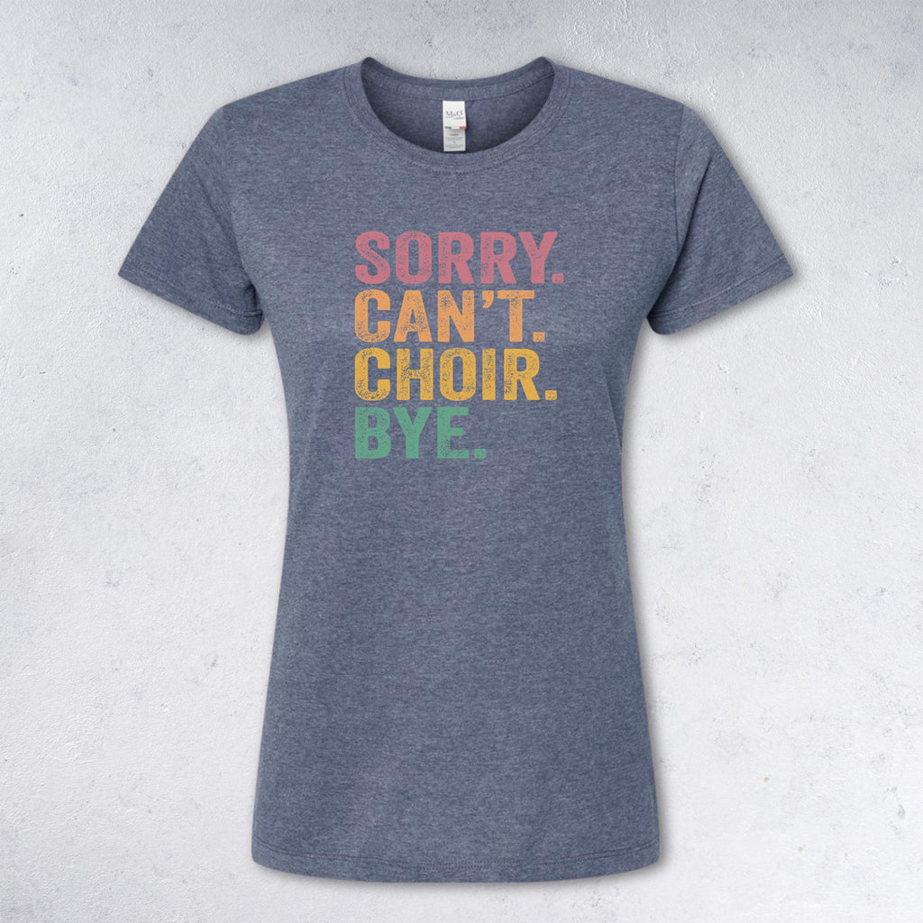 Gray t-shirt with colorful text 'SORRY. CAN'T. CHOIR. BYE.' on a light gray background