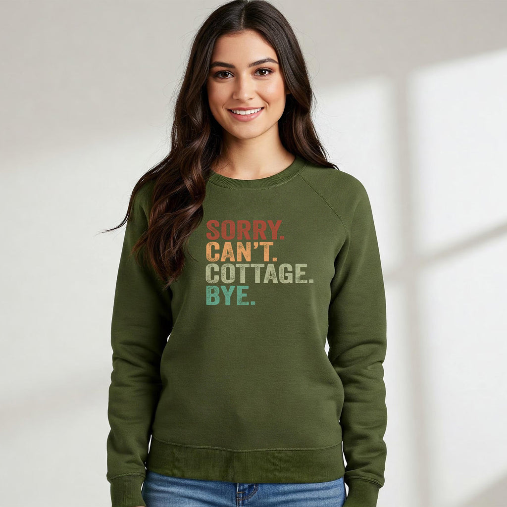 Woman wearing a green sweatshirt with colorful text on a plain background