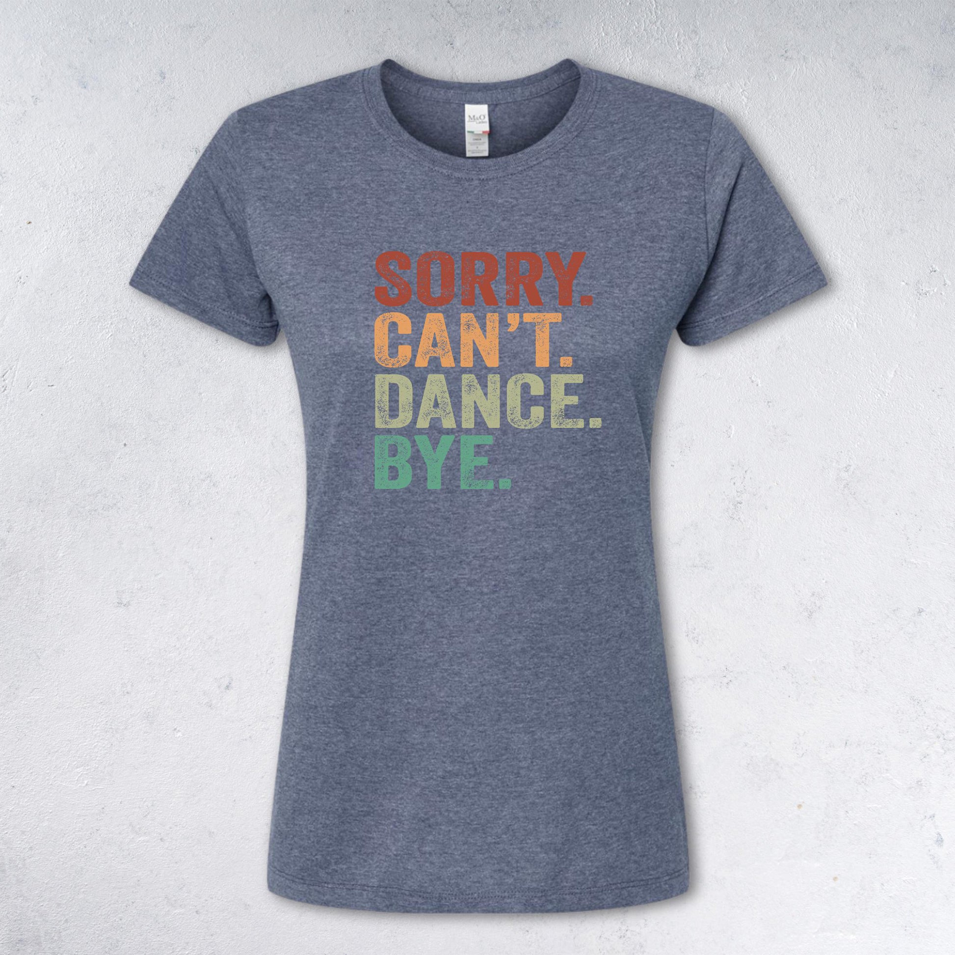 Blue t-shirt with colorful text 'SORRY. CAN'T. DANCE. BYE.' on a light BLUE background