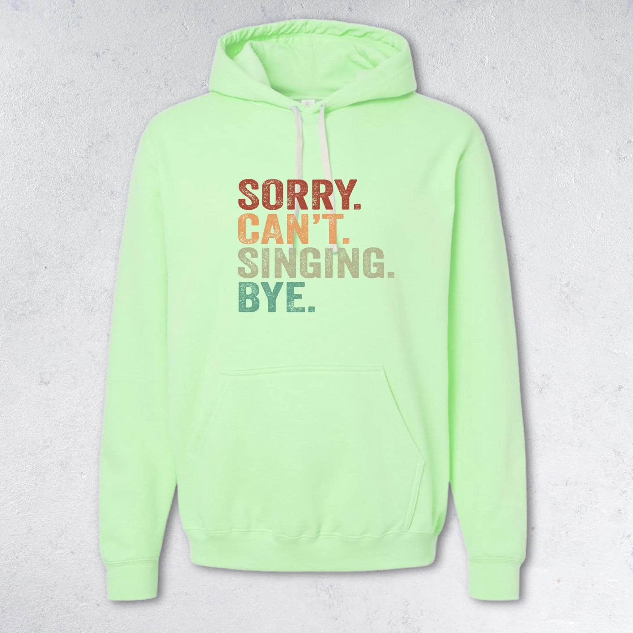 Neon green hoodie with colorful text on a light gray background